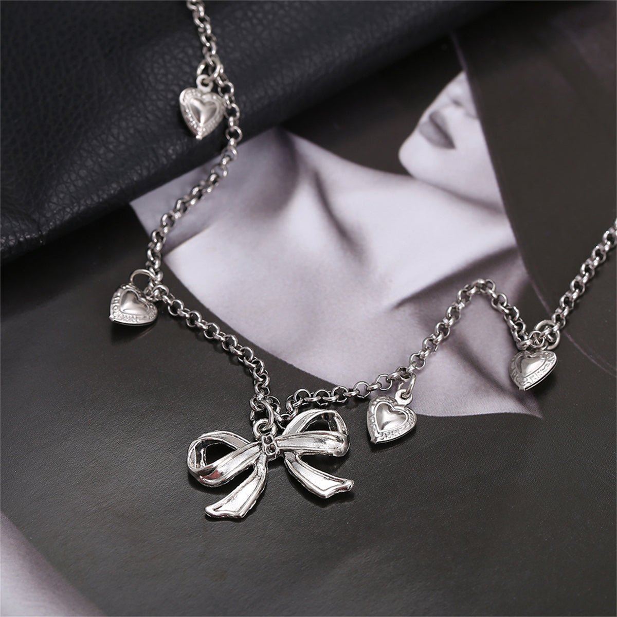 Silver-Plated Bow Heart Station Necklace, silver pendant necklace for women, elegant gift for her, lifestyle look