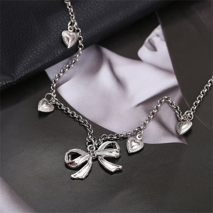 Silver-Plated Bow Heart Station Necklace, silver pendant necklace for women, elegant gift for her, lifestyle look