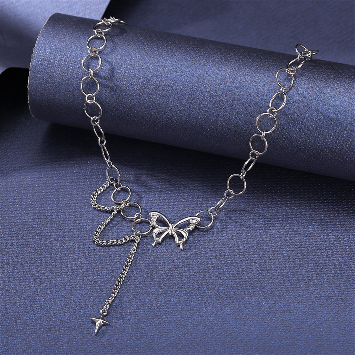 Silver-Plated Butterfly and Cross Pendant Choker, silver pendant necklace for women, everyday style, detail close-up
