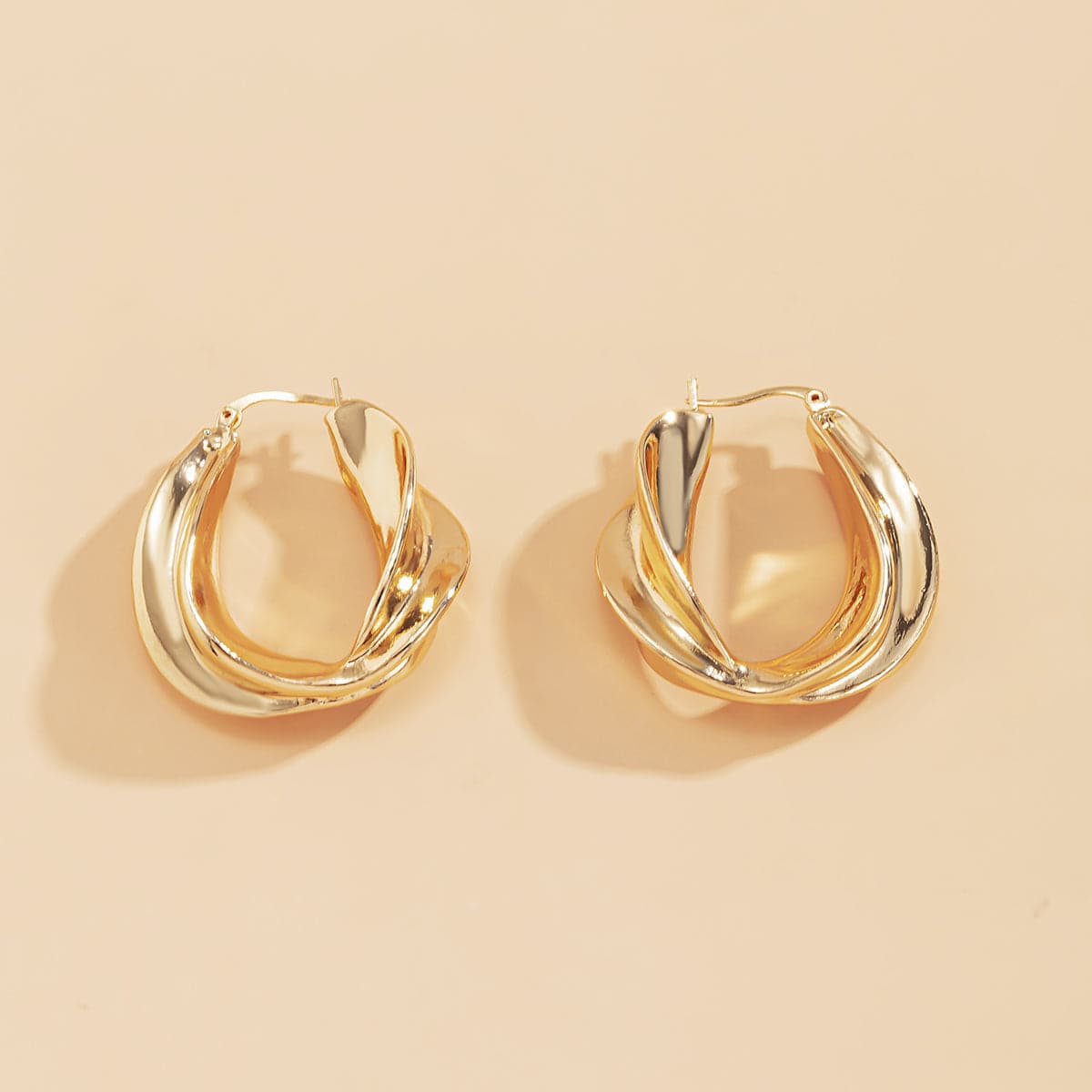 18K Gold-Plated Twist Huggie Earrings, gold huggie earrings, dainty minimalist design, side view
