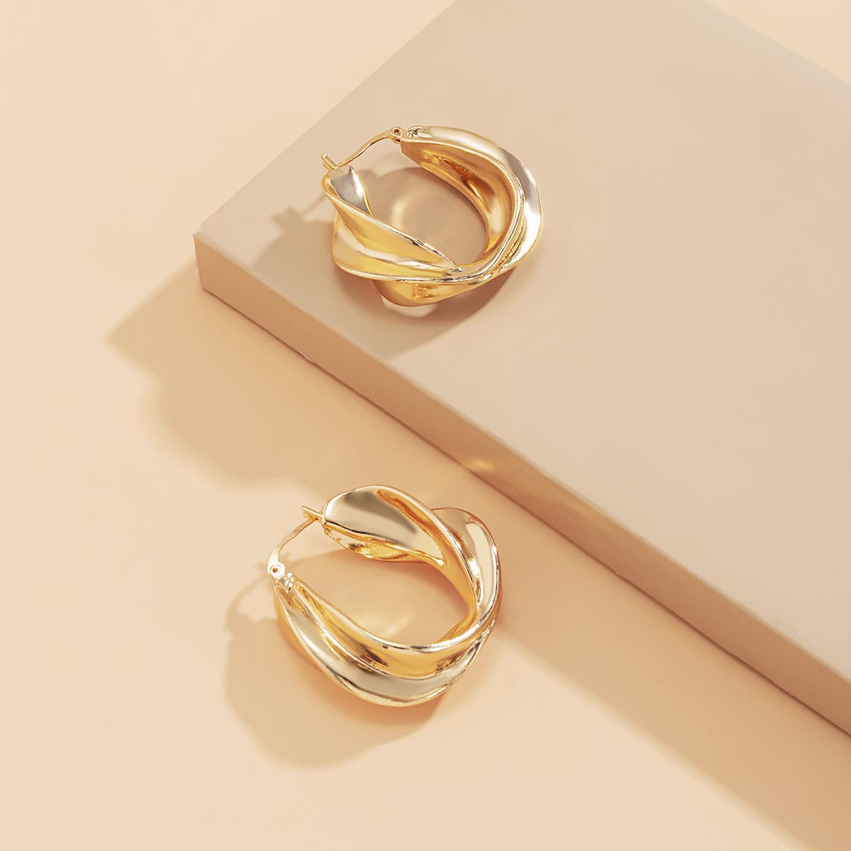 18K Gold-Plated Twist Huggie Earrings, gold huggie earrings, dainty minimalist design, detail close-up