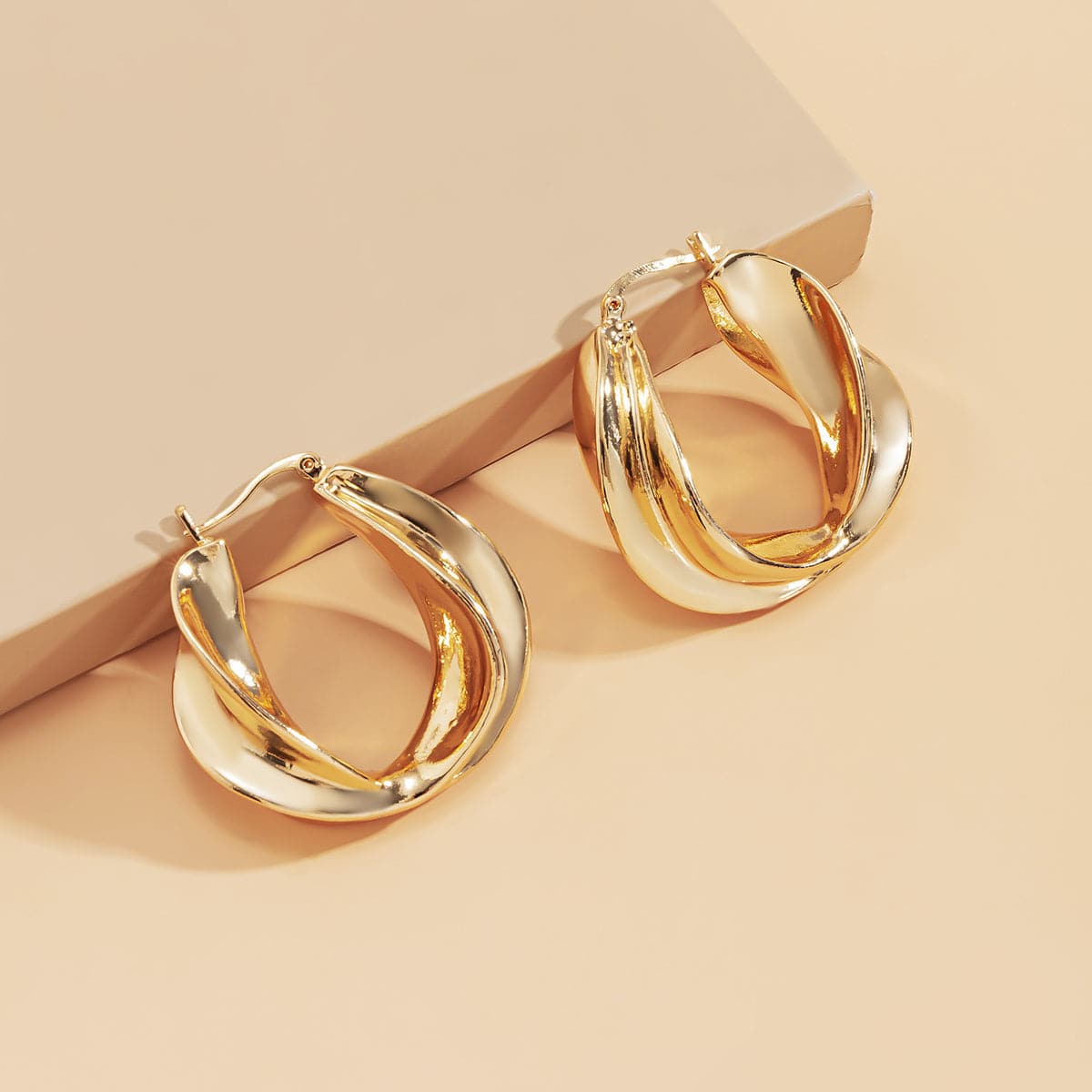 18K Gold-Plated Twist Huggie Earrings, gold huggie earrings, dainty minimalist design, lifestyle look