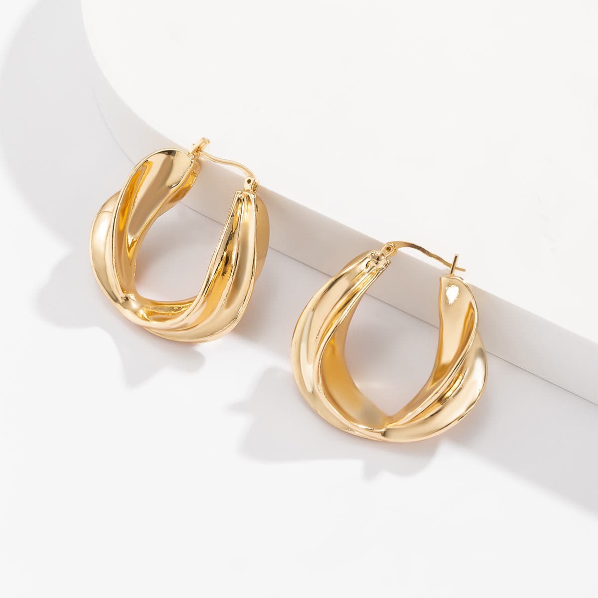 18K Gold-Plated Twist Huggie Earrings, gold huggie earrings, dainty minimalist design, styled look