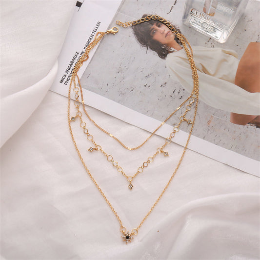 Cubic Zirconia and 18K Gold-Plated Star Layered Pendant Necklace, gold pendant necklace for women, everyday style, front view