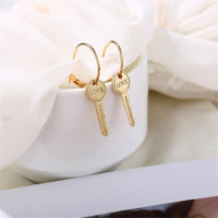 Goldtone 'Love' Key Drop Earrings
