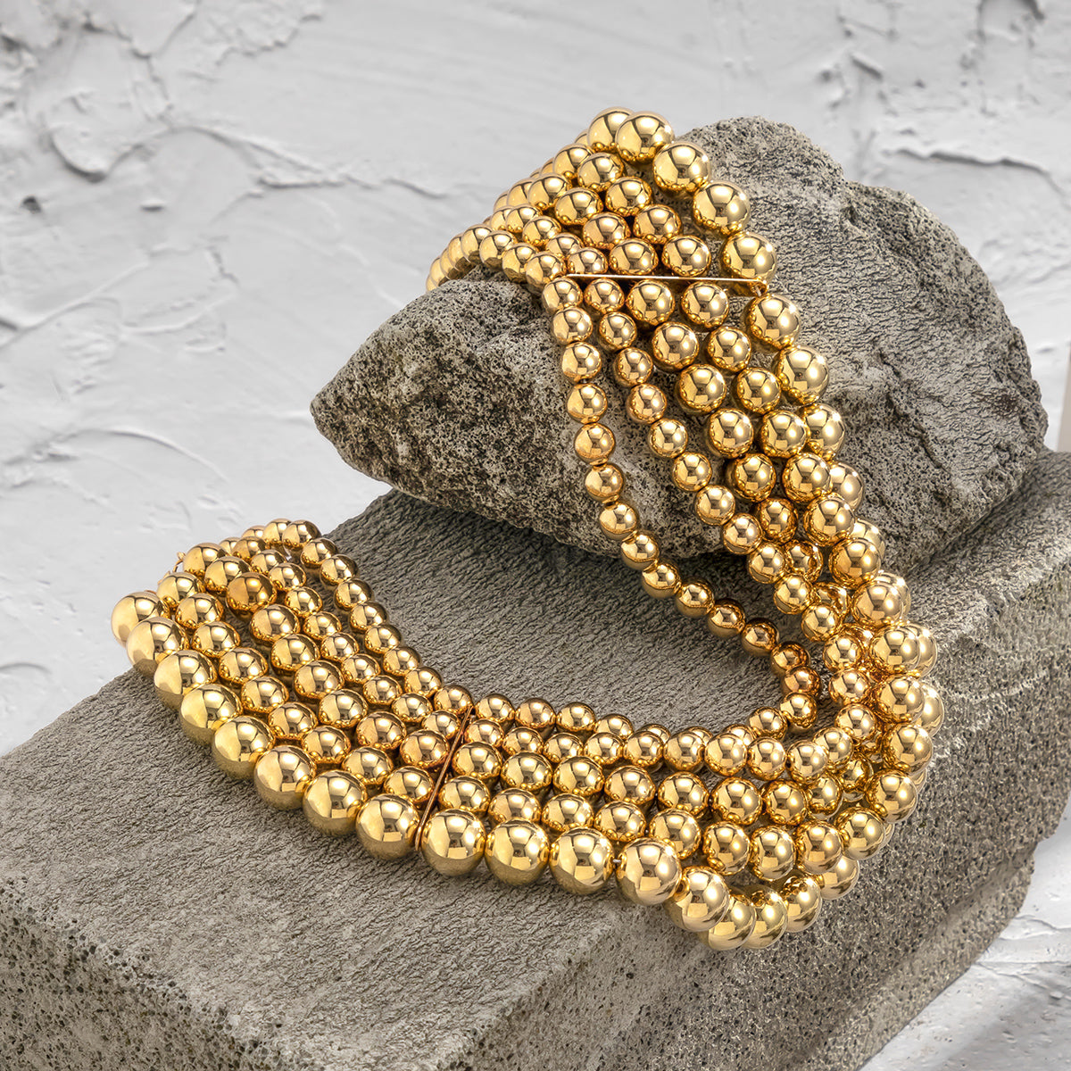 Eye-catching 18K gold-plated necklace showcasing layered golden beads and a fashionable chain, ideal for elevating your style.