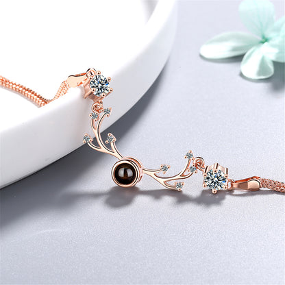 Cubic Zirconia and 18K Rose Gold-Plated Antler Charm Bracelet, rose gold bracelet for women, detail close-up
