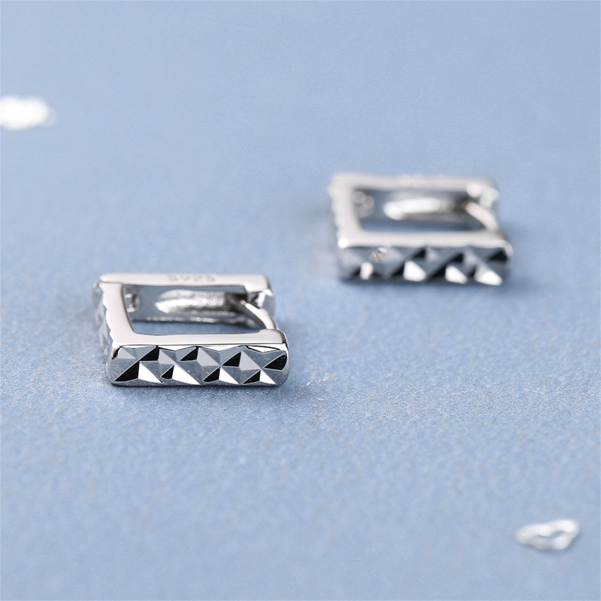 Silver-Plated Diamond-Cut Open Square Huggie Earrings, silver huggie earrings, botanical inspired, detail close-up