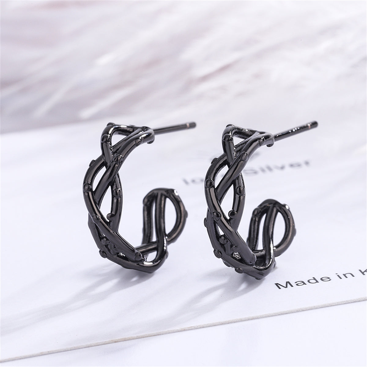 Black Twisted Huggie Earrings, huggie earrings, botanical inspired, side view