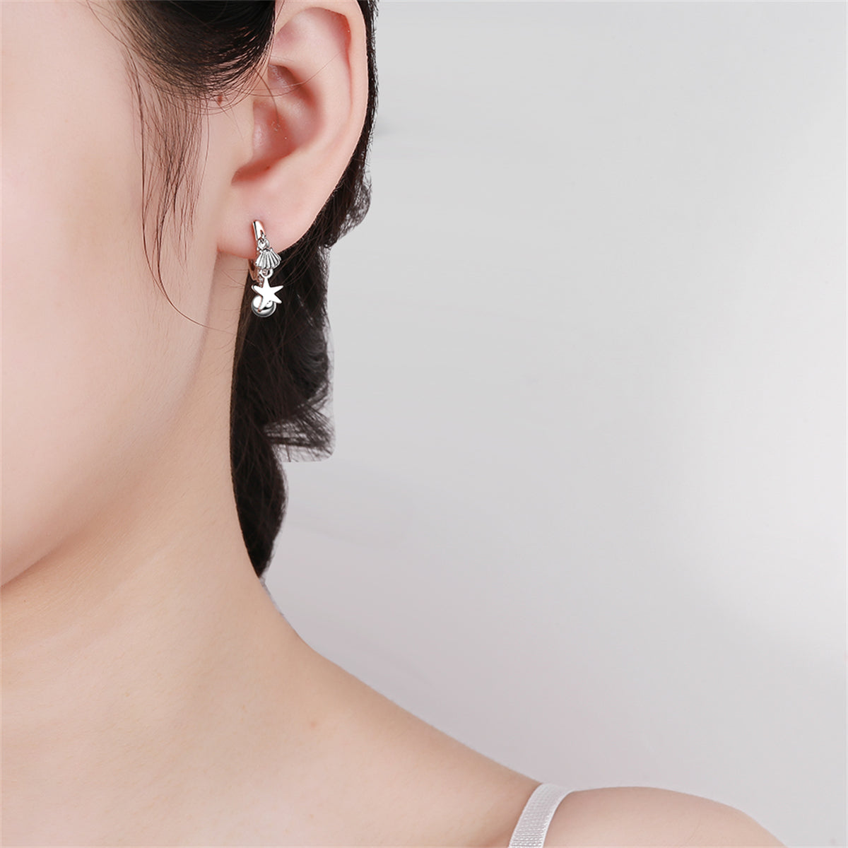 Silver-Plated Starfish Shell Charm Huggie Earring, silver huggie earrings, vintage-inspired design, lifestyle look