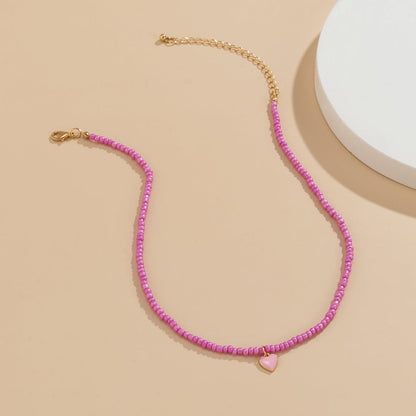 Pink Enamel and Howlite Beaded Heart Necklace, pendant necklace for women, everyday style, detail close-up