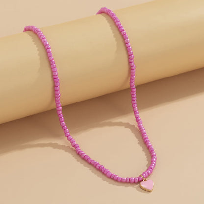 Pink Enamel and Howlite Beaded Heart Necklace, pendant necklace for women, everyday style, side view