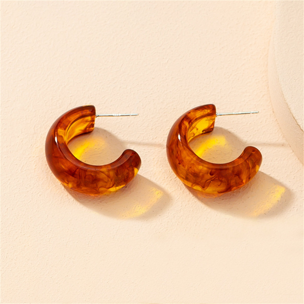 Amber Resin and Silver-Plated Huggie Earrings, silver huggie earrings, dainty minimalist design, side view
