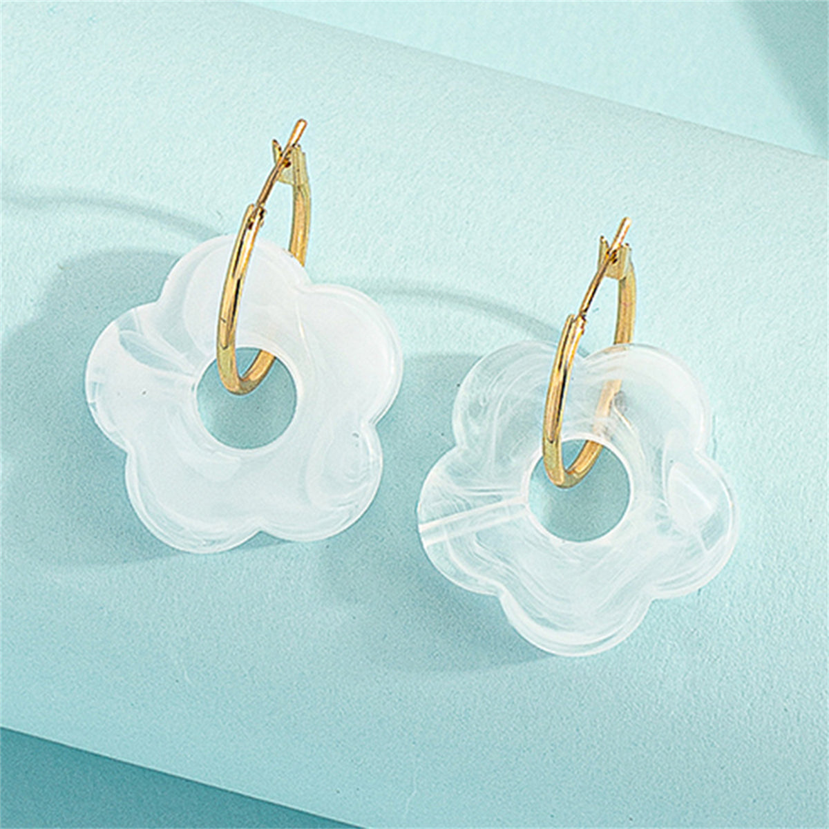 White Resin and 18K Gold-Plated Floral Huggie Earrings, gold huggie earrings, vintage-inspired design, side view