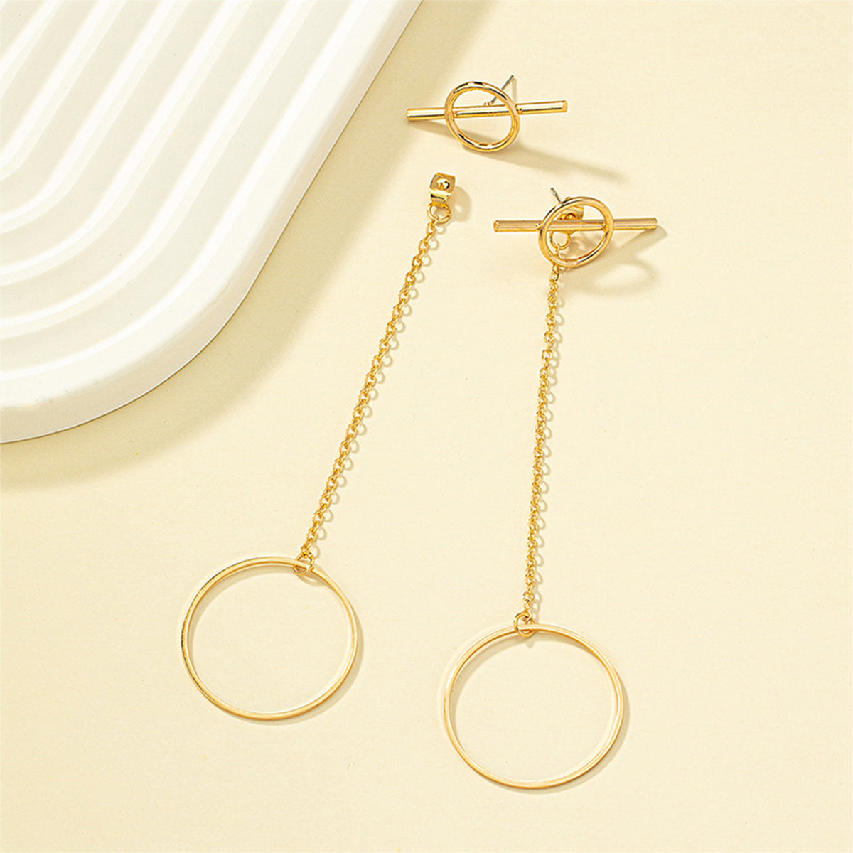 Beautiful gold tone ear jackets with a circle and chain design, crafted in 18K gold plating for a luxurious finish.