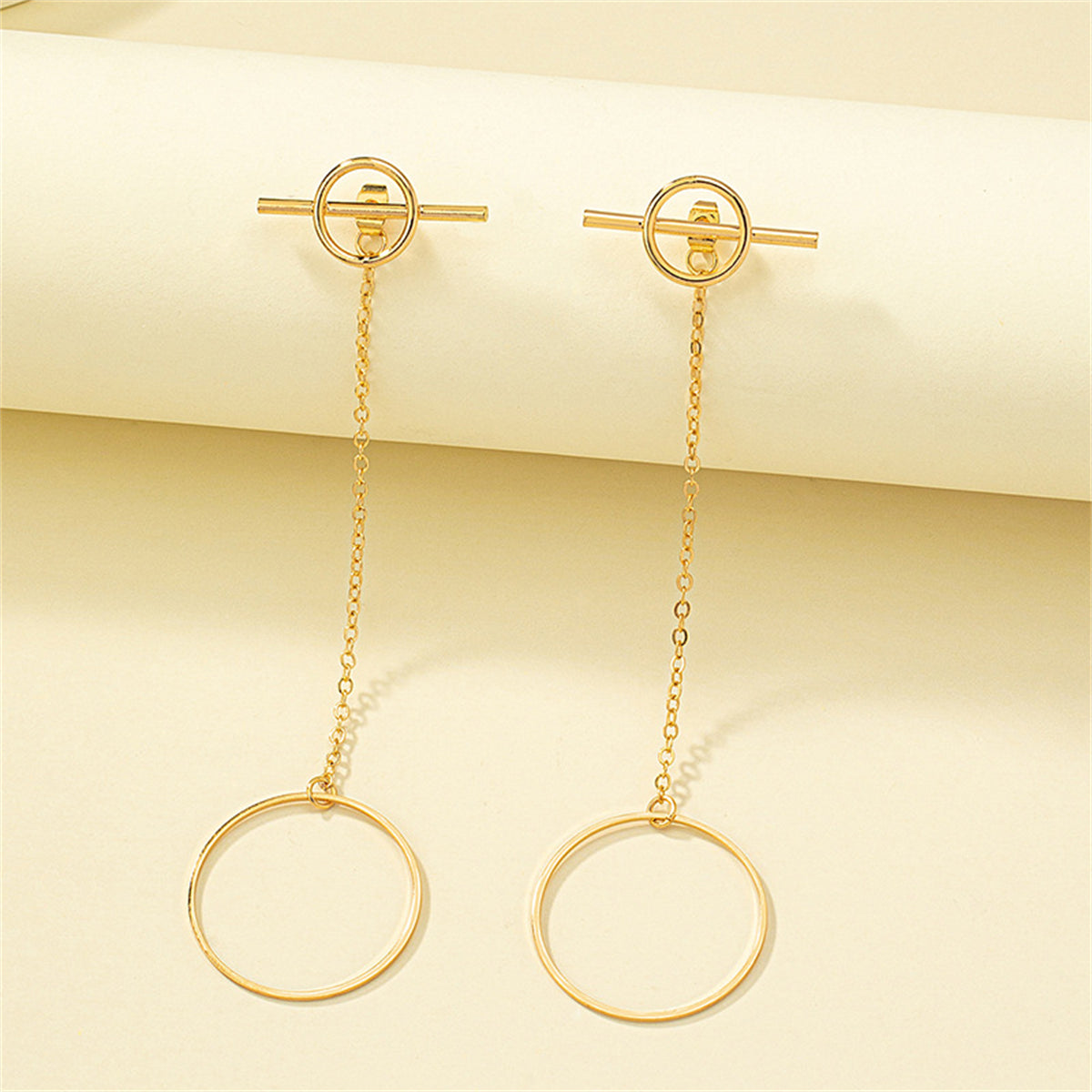 Chic 18K gold-plated earrings showcasing a unique circle and chain design, ideal for elevating your accessory game.
