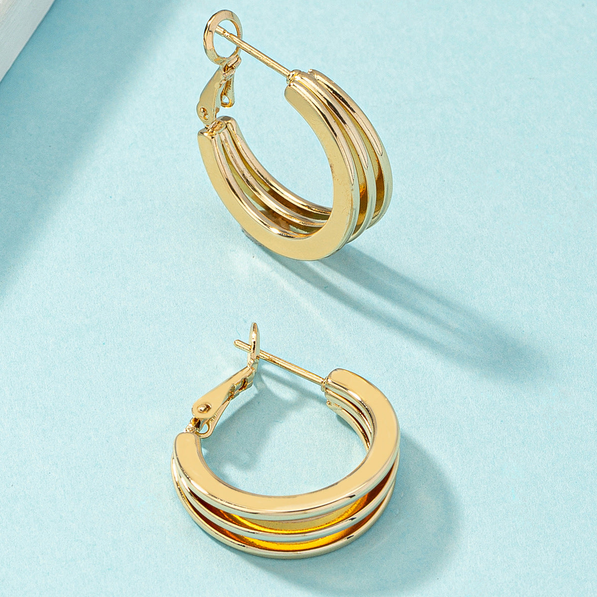 18K Gold-Plated Layered Huggie Earrings, gold huggie earrings, botanical inspired, front view
