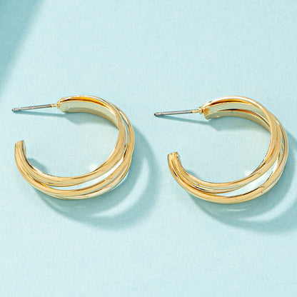 18K Gold-Plated Layered Huggie Earrings, gold huggie earrings, vintage-inspired design, detail close-up