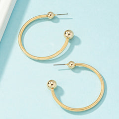 Stylish 18K gold-plated hoop earrings featuring ball ends, ideal for a sophisticated and trendy accessory choice.