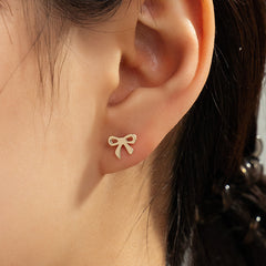 Stunning 18K gold-plated bow stud earrings, a chic accessory that enhances your style effortlessly.