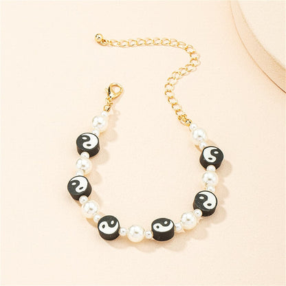 Black Polymer Clay and Pearl Yin Yang Station Bracelet, bracelet for women, botanical inspired, front view