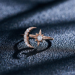 Stunning rose gold-plated ring with a celestial star and moon design, featuring brilliant cubic zirconia details.
