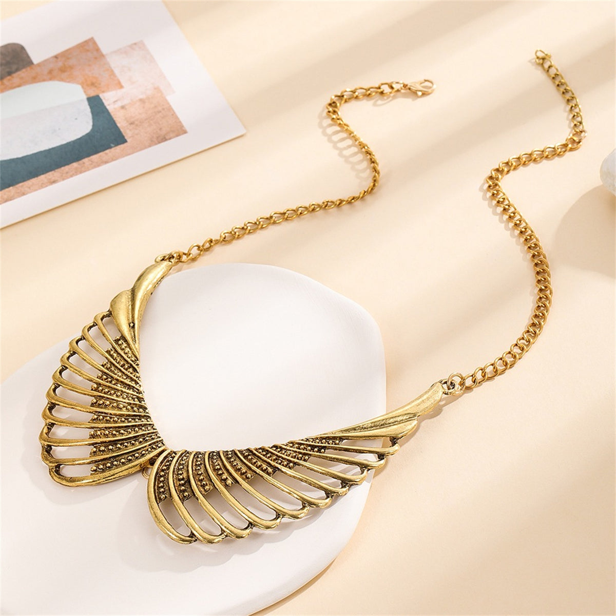 18K Gold-Plated Wing Bib Necklace, gold pendant necklace for women, botanical inspired, detail close-up