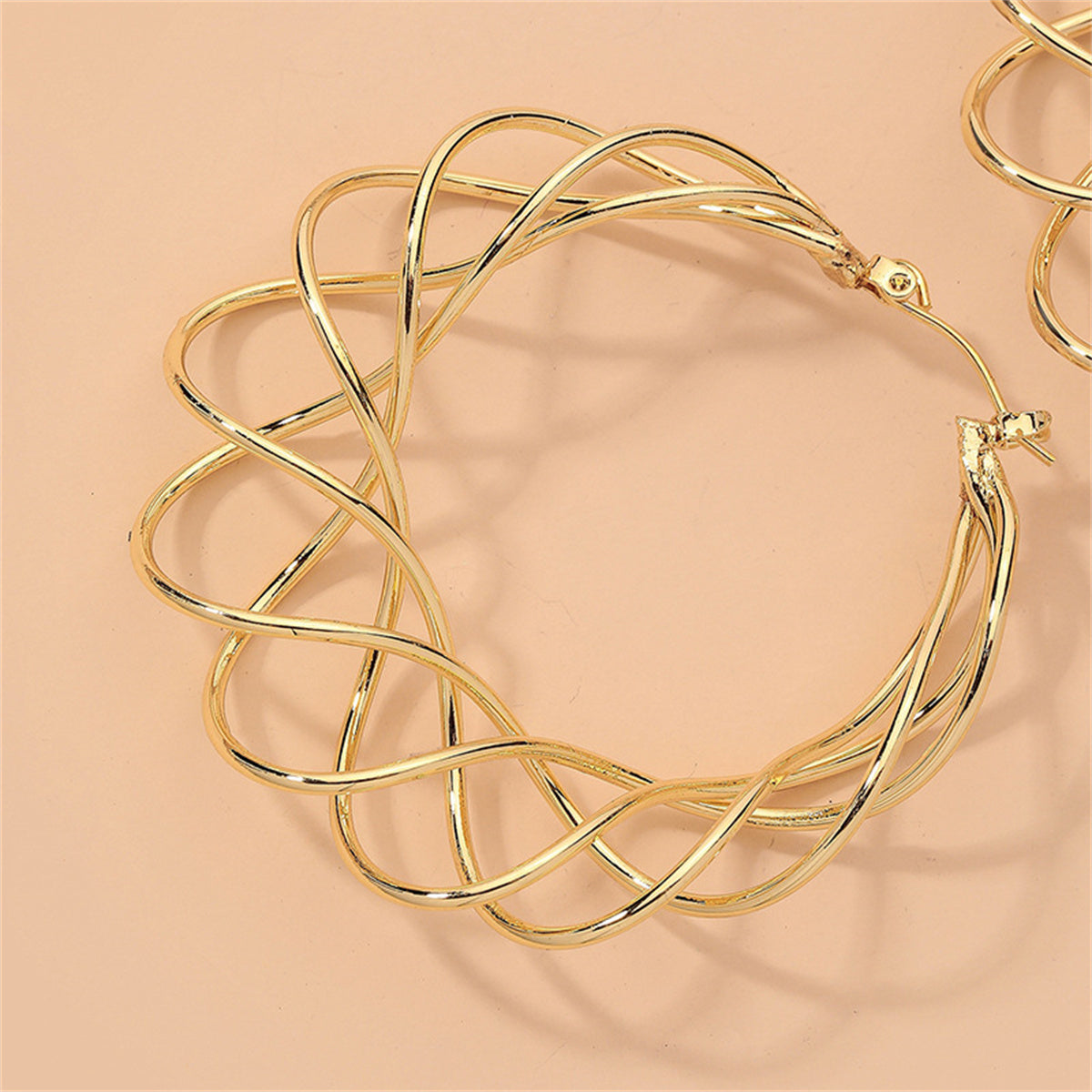 Eye-catching 18K gold-plated abstract nest hoop earrings, ideal for making a bold statement and enhancing your jewelry collection.