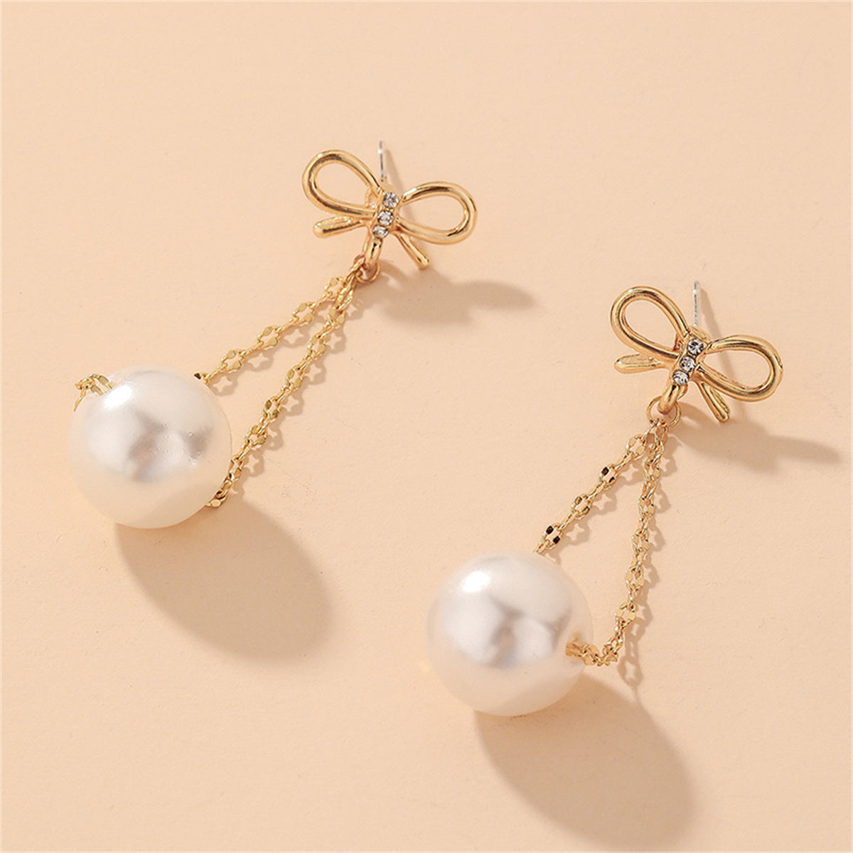 Cubic Zirconia and Pearl 18K Gold-Plated Bow Chain Drop Earrings, gold drop earrings for women, detail close-up