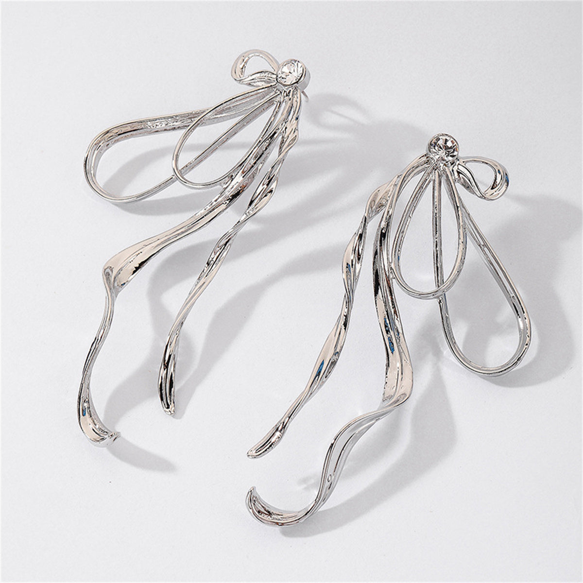 Cubic Zirconia and Silver-Plated Twist Bow Drop Earrings, silver drop earrings for women, everyday style, side view