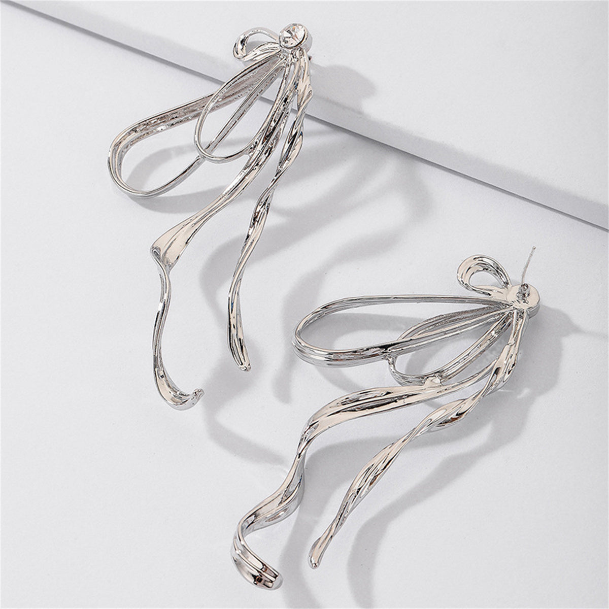 Cubic Zirconia and Silver-Plated Twist Bow Drop Earrings, silver drop earrings for women, everyday style, lifestyle look