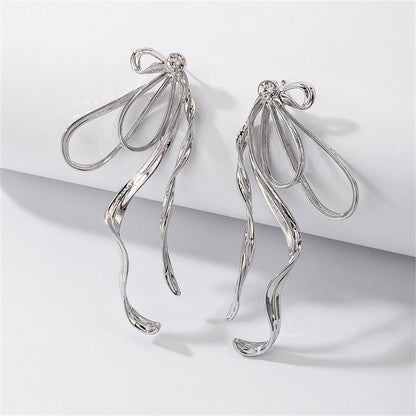 Cubic Zirconia and Silver-Plated Twist Bow Drop Earrings, silver drop earrings for women, everyday style, detail close-up