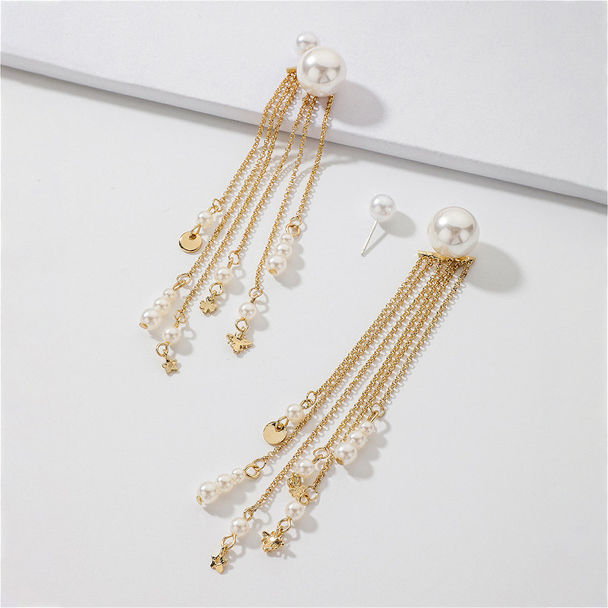 White Pearl and 18K Gold-Plated Tassel Ear Jackets, gold drop earrings for women, botanical inspired, lifestyle look