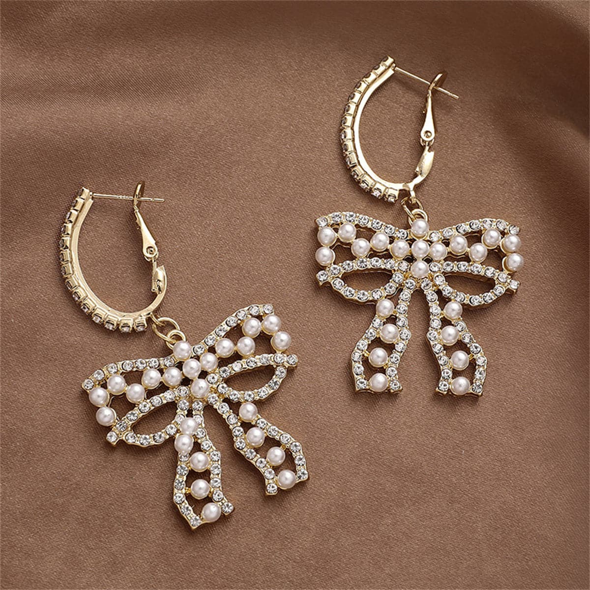 Cubic Zirconia and Pearl Bow Huggie Drop Earrings, huggie earrings, botanical inspired, front view