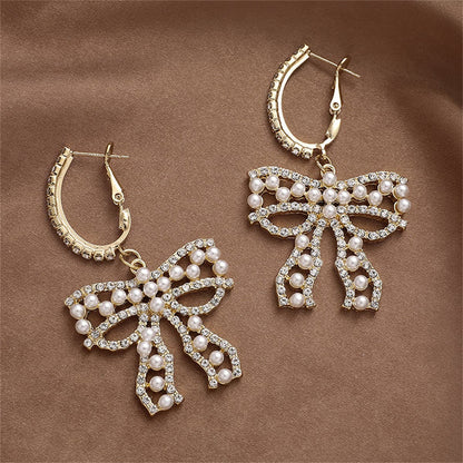 Cubic Zirconia and Pearl Bow Huggie Drop Earrings, huggie earrings, botanical inspired, front view