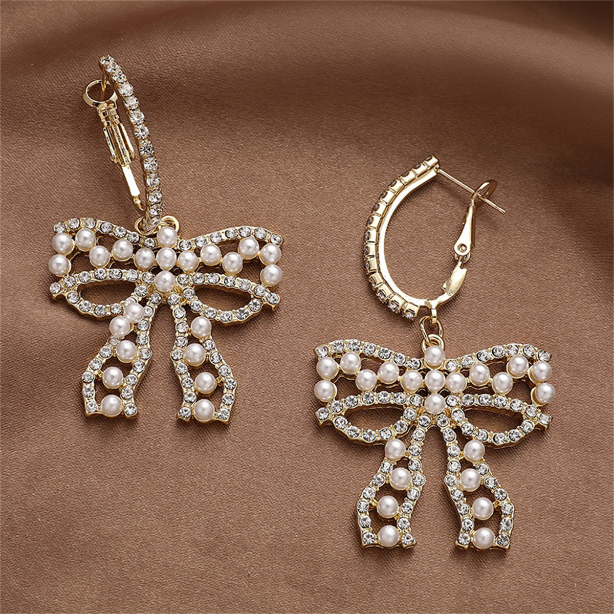 Cubic Zirconia and Pearl Bow Huggie Drop Earrings, huggie earrings, botanical inspired, detail close-up