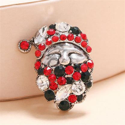 Green Cubic Zirconia and Silver-Plated Santa Brooch, silver brooch pin, botanical inspired, front view