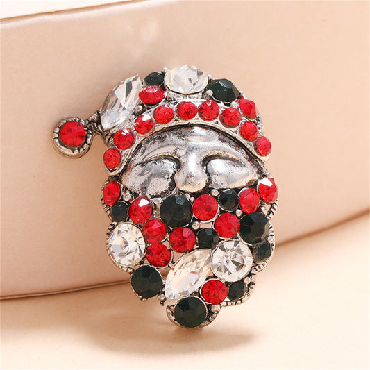Green Cubic Zirconia and Silver-Plated Santa Brooch, silver brooch pin, botanical inspired, front view