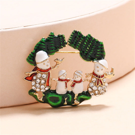 Cubic Zirconia and Green Snowman Family Brooch, brooch pin, botanical inspired, front view