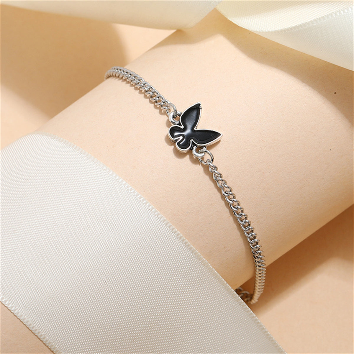 Black Enamel and Silver-Plated Butterfly Charm Bracelet, silver bracelet for women, vintage-inspired design, side view