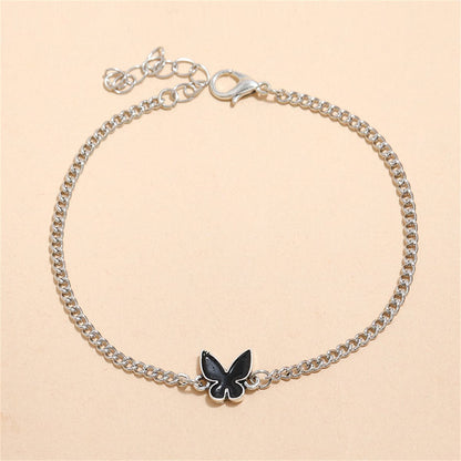 Black Enamel and Silver-Plated Butterfly Charm Bracelet, silver bracelet for women, vintage-inspired design, front view
