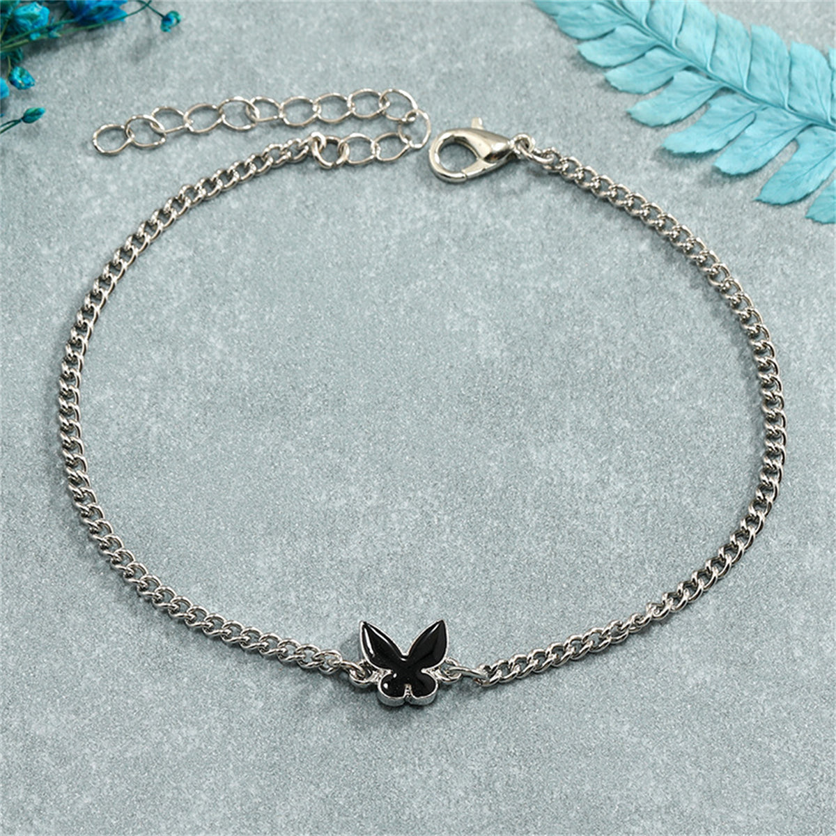 Black Enamel and Silver-Plated Butterfly Charm Bracelet, silver bracelet for women, vintage-inspired design, detail close-up