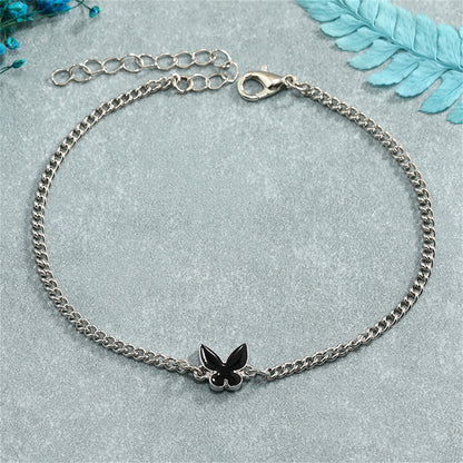 Black Enamel and Silver-Plated Butterfly Charm Bracelet, silver bracelet for women, vintage-inspired design, detail close-up