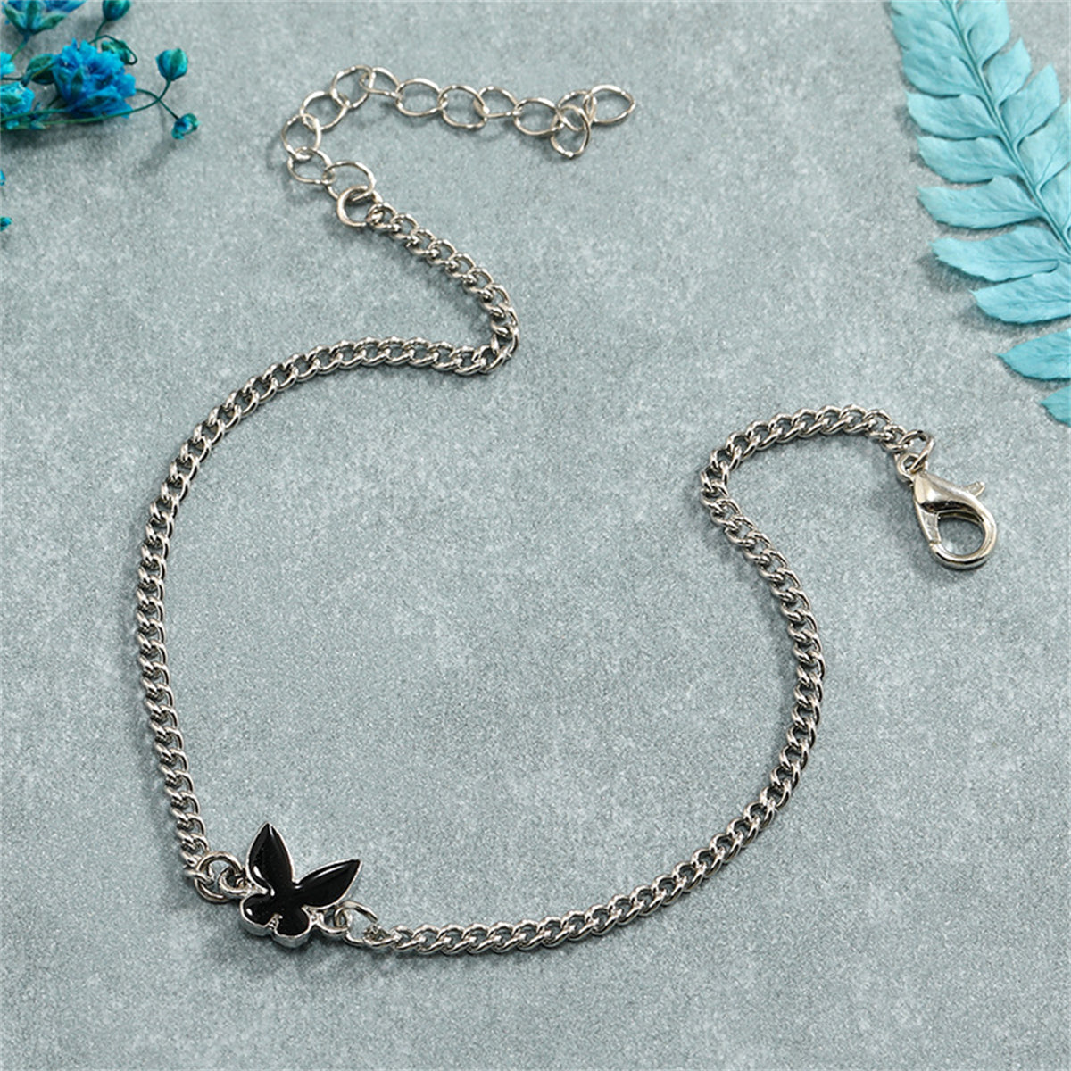 Black Enamel and Silver-Plated Butterfly Charm Bracelet, silver bracelet for women, vintage-inspired design, lifestyle look