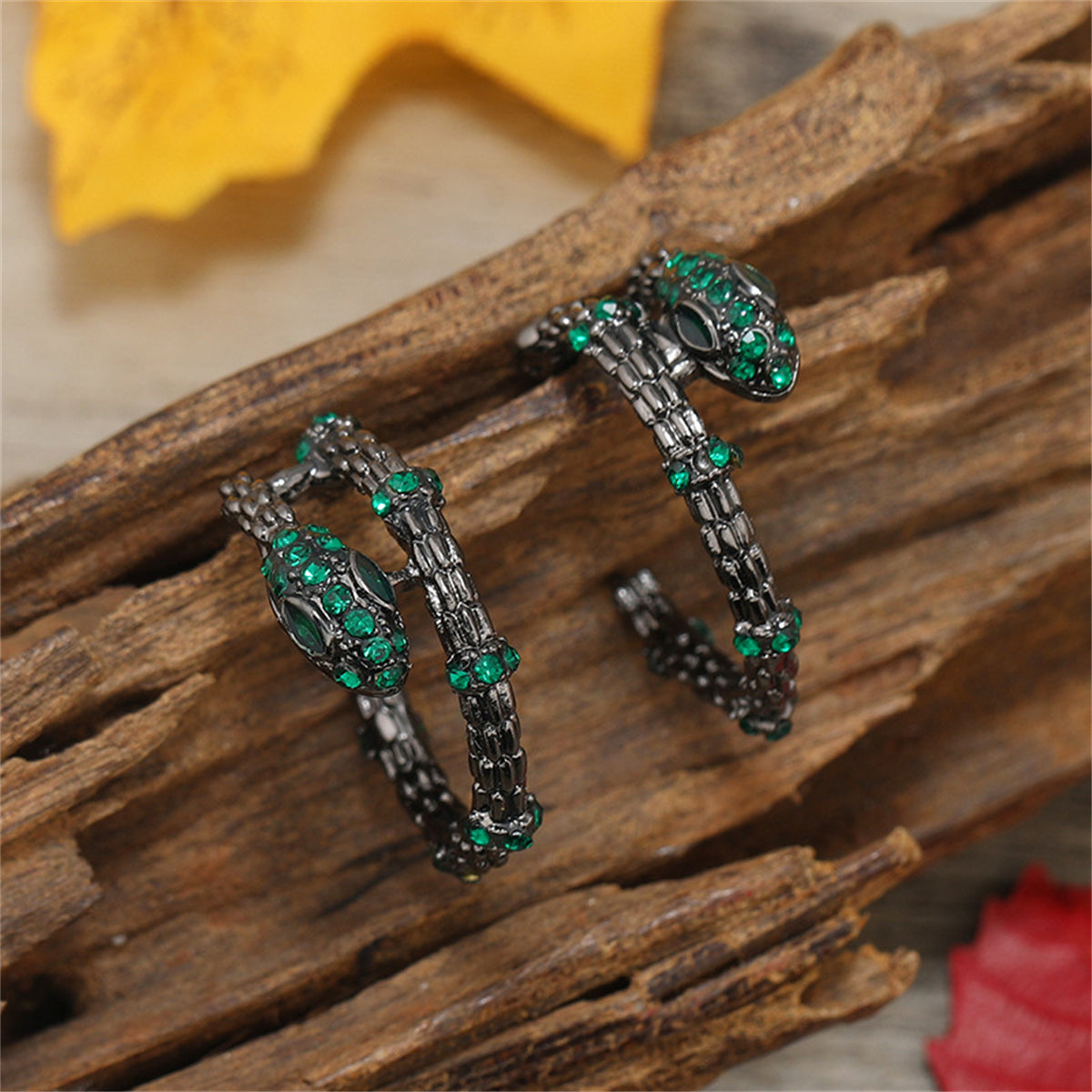 Green Cubic Zirconia and Black-Plated Snake Huggie Earrings, huggie earrings, dainty minimalist design, front view