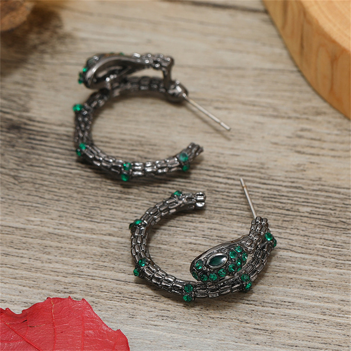 Green Cubic Zirconia and Black-Plated Snake Huggie Earrings, huggie earrings, dainty minimalist design, detail close-up