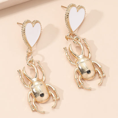 White Enamel and 18K Gold-Plated Heart Insect Drop Earring, gold drop earrings for women, botanical inspired, detail close-up