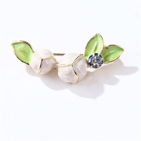Cubic Zirconia and Green Enamel Magnolia Brooch, brooch pin, botanical inspired, front view