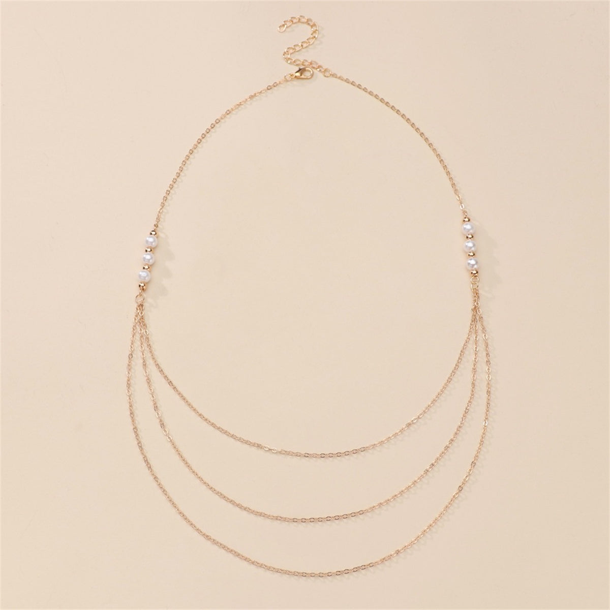 Exquisite layered necklace in 18K gold plating, embellished with three rows of diamonds and elegant pearls.