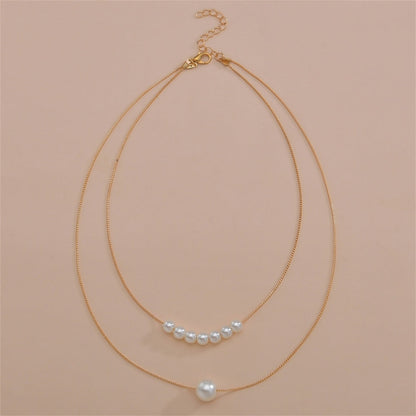 Pearl and 18K Gold-Plated Beaded Layered Necklace, gold pendant necklace for women, vintage-inspired design, lifestyle look